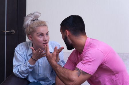 Angry man and woman shouting to each otherの写真素材