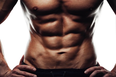 Male fitness model showing sixpack abdominal