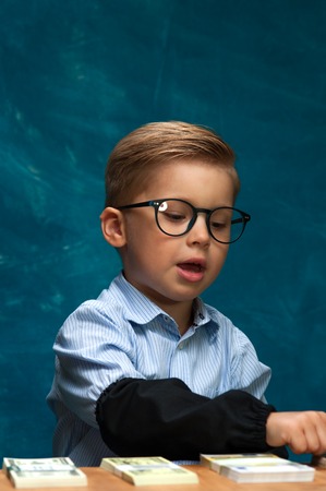 Portrait of successful business child at workplaceの写真素材