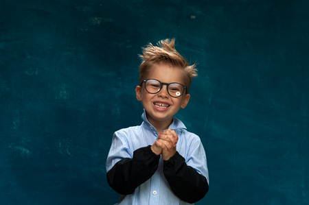 Portrait of happy smiling child with eyeglassesの写真素材