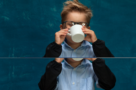 Stylish business child having a break at workplaceの写真素材