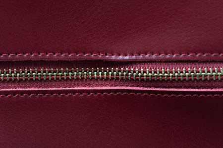 Detail of red leather bag, golden zipperの写真素材
