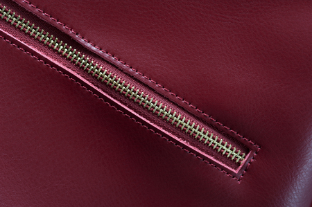 Detail of red leather bag, golden zipperの写真素材