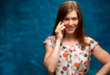 Smiling caucasian woman using her smartphone.