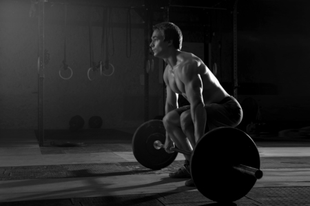 Young muscular man preparing for strength trainingの写真素材