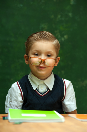 Cute positive little boy with glassesの写真素材