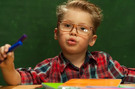 Handsome blond little boy with glasses