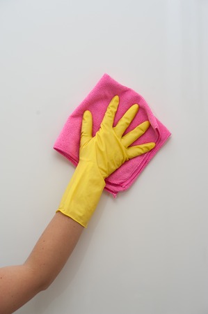House cleaning - female hand in glove