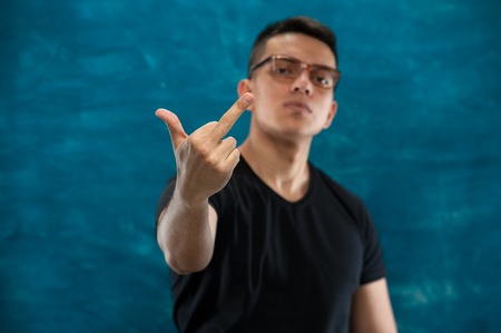 Attractive man posing on dark backgroundの写真素材