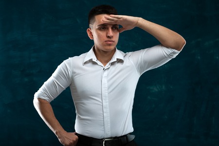 Attractive man posing on dark backgroundの写真素材