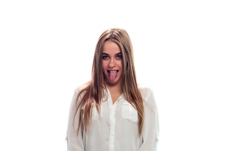 Charming young girl posing on white backgroundの写真素材