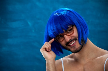 Portrait of cute young male cross dressing personの写真素材