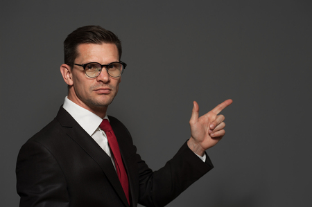 Cute businessman posing in studioの写真素材