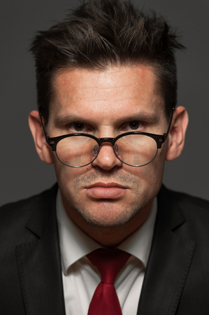 Cute businessman posing in studioの写真素材