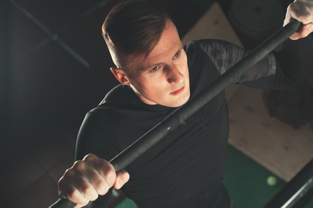 Male athlete working out in the gymの写真素材