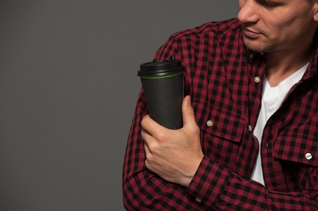 Attractive man posing on dark backgroundの写真素材