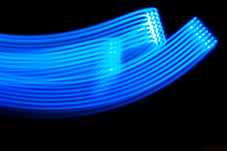 Blue neon strip lights against black background.