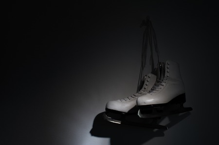 Ice female vintage skates on dark wallの写真素材