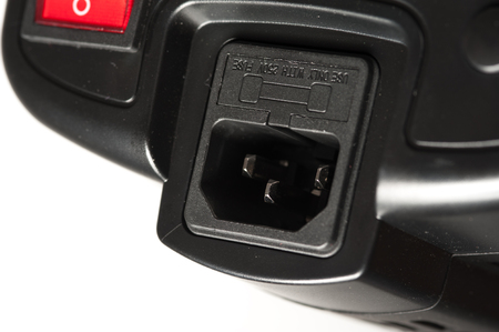 Power cable socket of a black studio illuminator