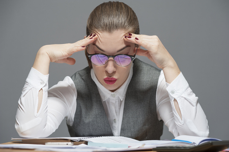 A businesswoman feeling exhausted and tiredの写真素材