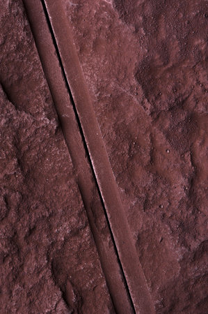 Close-up of joint of two red rustic bricks