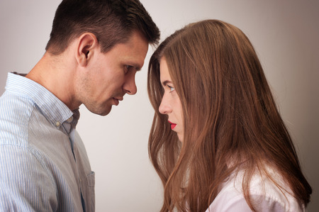 Angry couple looking at each other closeの写真素材