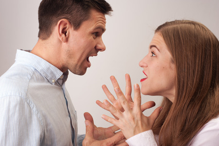 Profiles of couple shouting during the quarrelの写真素材