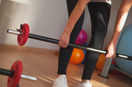 Group of Fit young women exercising with barbellsの写真素材