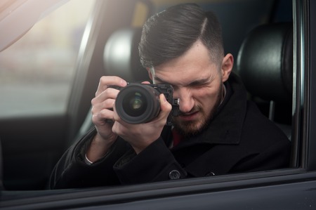 Close-up - Young Man Photorapher Sitting In The Carの写真素材