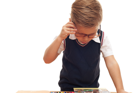 Stylish little school boy in white shirt and glassesの写真素材