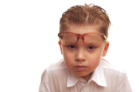 Portrait of a little serious boy in a funny glassesの写真素材