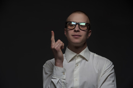 Smart funny young student guy with glasses