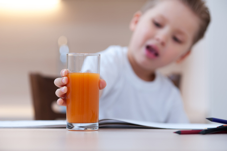 Cute boy in white T-shirt paint coloringの写真素材