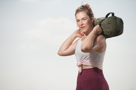 Sporty woman training at the beach.