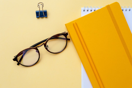 Red retro styled alarm clock on heap of american dollars.の写真素材