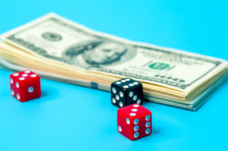 Playing Dices and Stack of American Dollars Billsの写真素材
