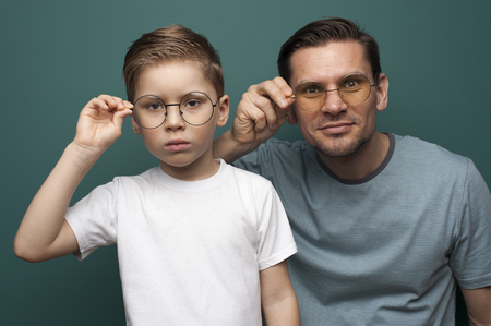 Shot of handsome father and son wearing stylish eyeglassesの写真素材