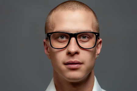 Portrait of a young man a manager in glasses