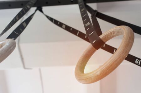 Two wooden rings for sports on the crossbar