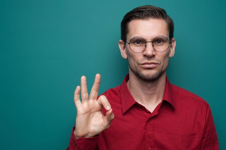 Portrait of a happy young man in glasses