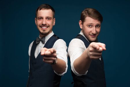 Close-up portrait of two positive young menの写真素材