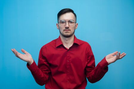 Portrait of a sad frustrated man with glassesの写真素材