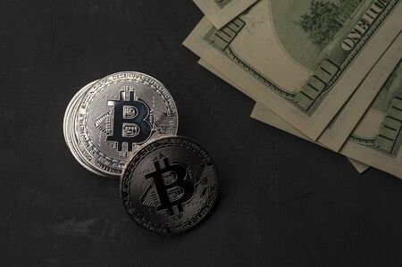 Close-up of a stack of silver Bitcoin coins