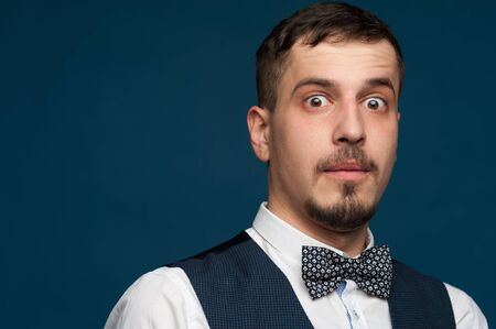 Positive young man in formal suit