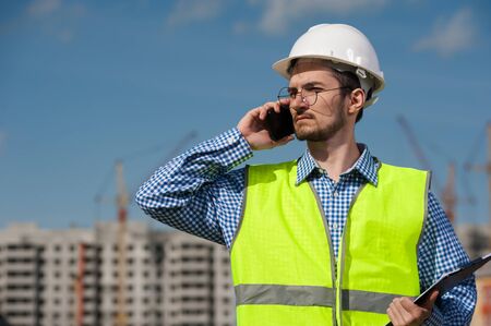Chief Engineer Man In Green Vest And Helmet
