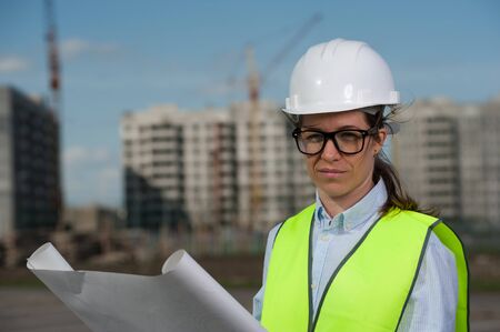 Chief Engineer Woman In Green Vest And Helmetの写真素材