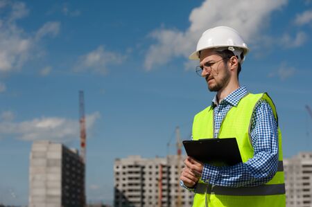 Chief Engineer Man In Green Vest And Helmet