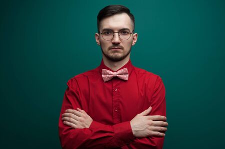 Portrait of an serious young man with glassesの写真素材