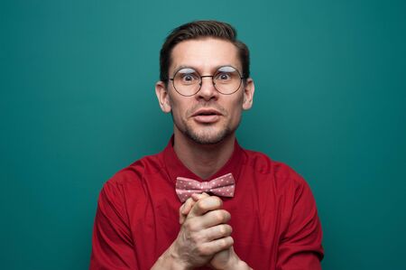 Portrait of a grateful young man in glassesの写真素材