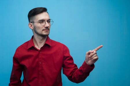 Portrait of a positive young man with glassesの写真素材